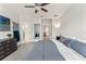 Spacious primary bedroom features a full-sized bed, ceiling fan, and dresser at 6731 Rocky Park St, Tampa, FL 33625