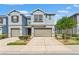 Inviting two-story townhome with well-manicured landscaping and a two-car garage at 6731 Rocky Park St, Tampa, FL 33625