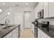 Contemporary kitchen features granite countertops, stainless steel appliances, and ample cabinet space at 6731 Rocky Park St, Tampa, FL 33625