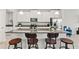 Modern kitchen features granite countertops, stainless steel appliances, and pendant lighting at 6731 Rocky Park St, Tampa, FL 33625