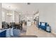 Bright, open-concept living space with modern decor, dining area, and island kitchen at 6731 Rocky Park St, Tampa, FL 33625