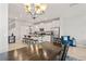 Open concept featuring kitchen with granite countertops, and a dark wood dining table at 6731 Rocky Park St, Tampa, FL 33625