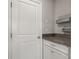 Convenient pantry area with granite countertop, cabinetry and wire rack shelving for storage at 6731 Rocky Park St, Tampa, FL 33625