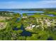 Stunning aerial view of the property surrounded by lush greenery and waterways at 6904 11Th Ave E, Palmetto, FL 34221