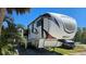 Spacious RV with ample storage, parked on supports offering a comfortable and convenient living experience at 6904 11Th Ave E, Palmetto, FL 34221