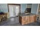 Kitchen island with granite countertop and wood accents, ready for renovation in the kitchen at 6904 11Th Ave E, Palmetto, FL 34221