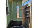 Outdoor shower featuring a multi-setting shower panel and built-in shelves, adding a unique amenity at 6904 11Th Ave E, Palmetto, FL 34221