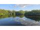 Scenic water view with lush greenery reflecting in the tranquil water at 6904 11Th Ave E, Palmetto, FL 34221