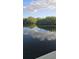 Calm waters with sky reflecting, creating a peaceful and relaxing environment at 6904 11Th Ave E, Palmetto, FL 34221