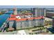 Spacious condo building featuring a red tile roof, lush landscaping, and convenient parking at 700 S Harbour Island Blvd # 740, Tampa, FL 33602