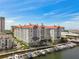 Stunning aerial view of waterfront building, marina, and boat slips under a bright blue sky at 700 S Harbour Island Blvd # 740, Tampa, FL 33602