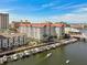 Aerial view showcases waterfront building with boat slips, and a beautiful coastal community at 700 S Harbour Island Blvd # 740, Tampa, FL 33602