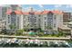 Waterfront condo community featuring a pool, marina access, and tropical landscaping at 700 S Harbour Island Blvd # 740, Tampa, FL 33602