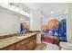 Bathroom featuring granite countertop, single sink, and a colorful shower curtain, creating a vibrant space at 700 S Harbour Island Blvd # 740, Tampa, FL 33602