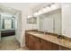 Bathroom with granite countertops, dual mirrors and sinks offering a blend of style and functionality at 700 S Harbour Island Blvd # 740, Tampa, FL 33602