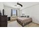 Bright bedroom with neutral decor, ceiling fan, and a comfortable sofa for relaxation, complemented by a large window at 700 S Harbour Island Blvd # 740, Tampa, FL 33602
