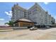 Multi-story condo building boasts a brick facade, a covered entrance, and meticulous landscaping at 700 S Harbour Island Blvd # 740, Tampa, FL 33602