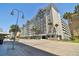 Modern condo exterior with palm trees, parking garage, and convenient street access at 700 S Harbour Island Blvd # 740, Tampa, FL 33602