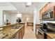 Kitchen features stainless steel appliances, granite countertops, and views into living area at 700 S Harbour Island Blvd # 740, Tampa, FL 33602