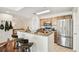Kitchen with granite countertops, stainless appliances, seating at the counter, and a refrigerator at 700 S Harbour Island Blvd # 740, Tampa, FL 33602