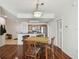 Elegant dining area and open kitchen with breakfast bar, hardwood and tile floors at 700 S Harbour Island Blvd # 740, Tampa, FL 33602