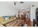 Inviting living room featuring hardwood floors, a comfortable sofa, and an open floor plan to dining and kitchen at 700 S Harbour Island Blvd # 740, Tampa, FL 33602
