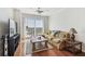 Comfortable living room with hardwood floors, sectional sofa, and large windows with urban views at 700 S Harbour Island Blvd # 740, Tampa, FL 33602