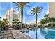 Outdoor pool area lined with lush palm trees and lounge chairs at 700 S Harbour Island Blvd # 740, Tampa, FL 33602