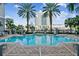 Community pool with palm trees and lounge chairs, perfect for relaxing and enjoying the Florida sunshine at 700 S Harbour Island Blvd # 740, Tampa, FL 33602