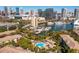 Aerial view of waterfront, showing a pool and buildings with skyline in the background at 716 Seagate Dr # 716, Tampa, FL 33602