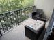 Relaxing balcony view, perfect for outdoor enjoyment with comfy seating and views of neighborhood at 716 Seagate Dr # 716, Tampa, FL 33602
