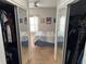 Bedroom view from closet with large bed and a large window letting in natural light at 716 Seagate Dr # 716, Tampa, FL 33602