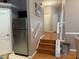 Entryway with hardwood floors, stainless steel refrigerator, and a staircase leading to another floor at 716 Seagate Dr # 716, Tampa, FL 33602