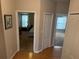 Hallway with a view into two bedrooms and a hall closet at 716 Seagate Dr # 716, Tampa, FL 33602