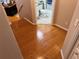 Hallway leading to a bathroom with bamboo floors at 716 Seagate Dr # 716, Tampa, FL 33602