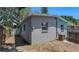 Backyard featuring a grey painted exterior with AC unit and a chain link fence at 7428 36Th N Ave, St Petersburg, FL 33710