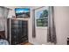 Bedroom with wooden floors and a black chest of drawers with TV on top at 7428 36Th N Ave, St Petersburg, FL 33710