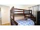 Bedroom featuring a wood frame bunkbed with a blue patterned coverlet at 7428 36Th N Ave, St Petersburg, FL 33710