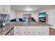 Open kitchen view with granite countertops, stainless steel appliances, and a glimpse into the living room at 7428 36Th N Ave, St Petersburg, FL 33710
