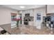Bright kitchen featuring granite countertops, stainless steel appliances and backsplash detail at 7428 36Th N Ave, St Petersburg, FL 33710