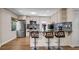 Modern kitchen with stainless steel appliances, granite countertops, and a breakfast bar with stylish stools at 7428 36Th N Ave, St Petersburg, FL 33710