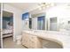 Bright bathroom with a long vanity, marble countertop, lots of storage, and tile floors at 7812 Turnbridge Dr, Port Richey, FL 34668