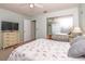 Comfortable bedroom features a ceiling fan, large closet, and a TV on a dresser at 7812 Turnbridge Dr, Port Richey, FL 34668