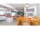 Eat-in kitchen with an open layout, allowing easy access to both the living and dining areas at 7812 Turnbridge Dr, Port Richey, FL 34668