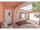 Inviting front entrance with tiled flooring, a decorative door, and mature landscaping at 7812 Turnbridge Dr, Port Richey, FL 34668