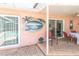 Outdoor patio features custom mural, brick flooring and sliding glass doors for easy indoor-outdoor flow at 7812 Turnbridge Dr, Port Richey, FL 34668