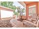 Charming patio with brick flooring and inviting seating for enjoying the outdoors at 7812 Turnbridge Dr, Port Richey, FL 34668