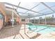 Enjoy the outdoors with this screened-in pool and patio area, perfect for entertaining and relaxing at 7812 Turnbridge Dr, Port Richey, FL 34668