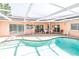 Enjoy a refreshing dip in your own private pool within the comfort of a screened enclosure at 7812 Turnbridge Dr, Port Richey, FL 34668