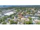 Aerial view of a neighborhood showcasing the property's location among lush trees and community amenities at 8130 129Th N Ln, Seminole, FL 33776